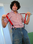 Horny man snapping his suspenders
