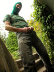 Unzipping his pants